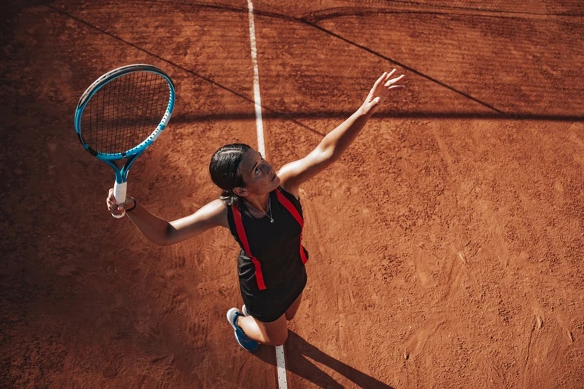 Aerial-view-of-woman-hitting-serve-during-game.webp.jpg