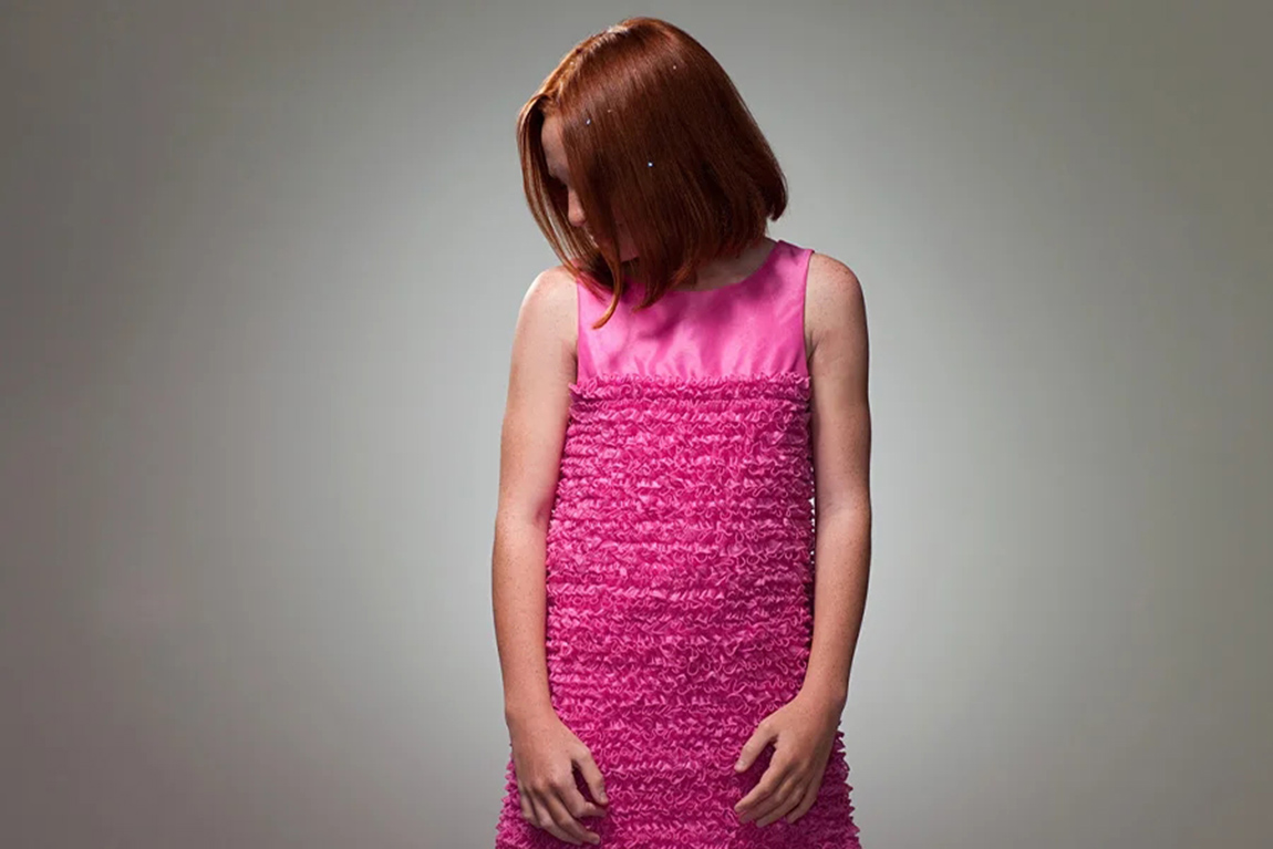 woman-wearing-a-pink-dress-made-from-ruched-fabric.webp.jpg