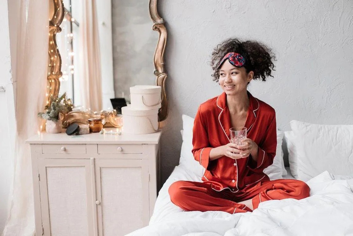 woman-rocking-a-red-pajamas-set-on-a-bed.webp.jpg
