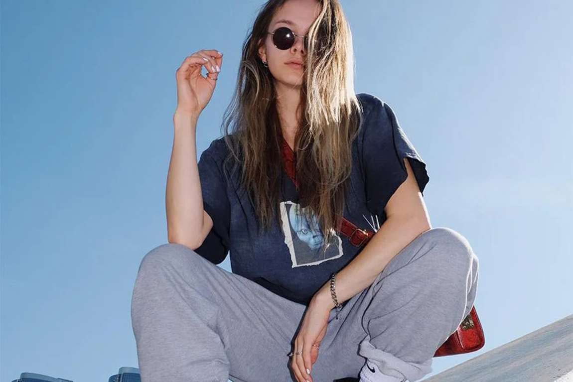 young-woman-wearing-blue-tee-over-a-gray-sweatpant.webp.jpg