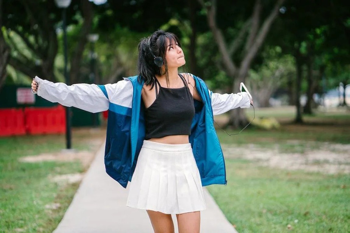 woman-looking-up-while-rocking-a-white-miniskirt.webp.jpg
