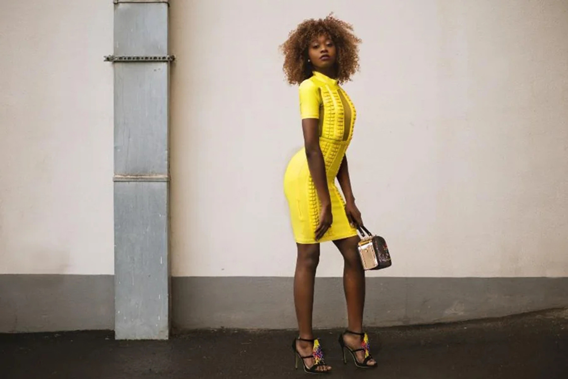 woman-wearing-a-bright-yellow-knitted-dress-1.webp.jpg