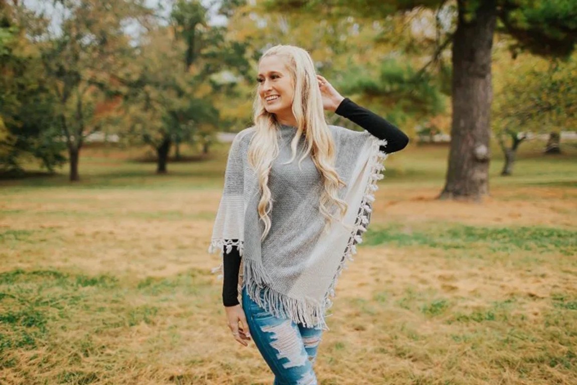woman-wearing-a-white-and-gray-poncho.webp.jpg