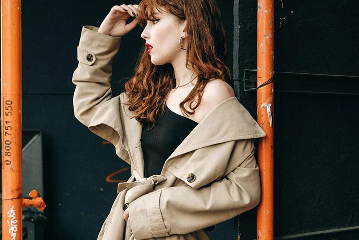 woman-rocking-a-cream-colored-top-coat-outdoors.webp.jpg