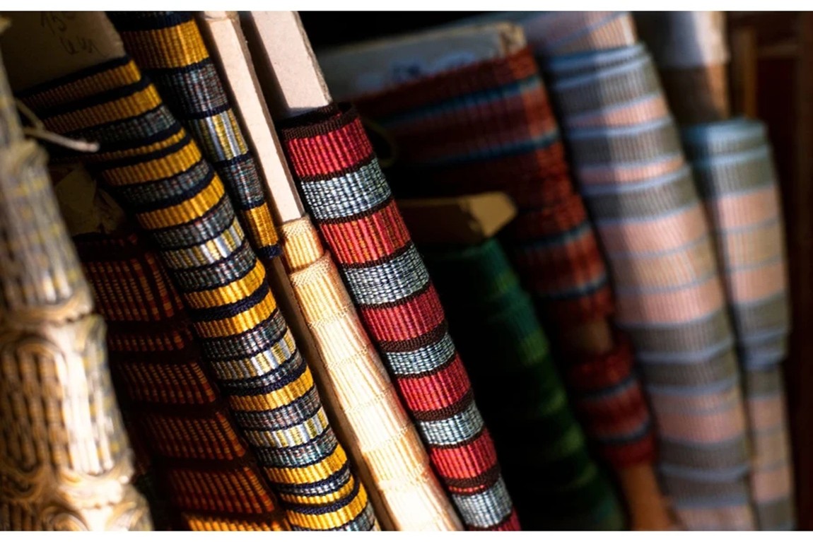 Multi-Colored-And-Patterned-Rolls-Of-Ribbon-On-A-Shelf.webp.jpg