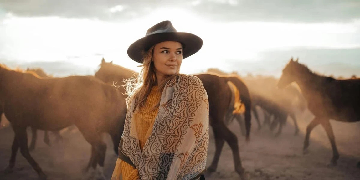 Woman-in-a-cowgirl-attire.webp.jpg