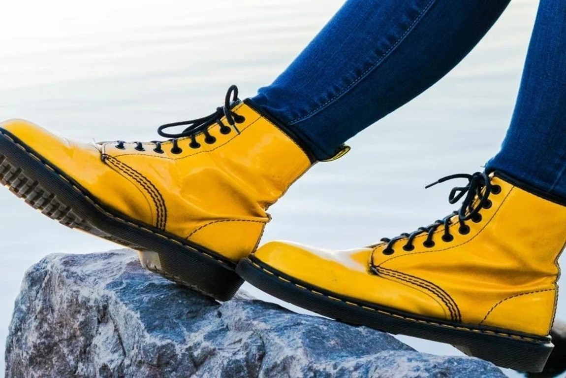 A-woman-wearing-yellow-combat-boots.webp.jpg