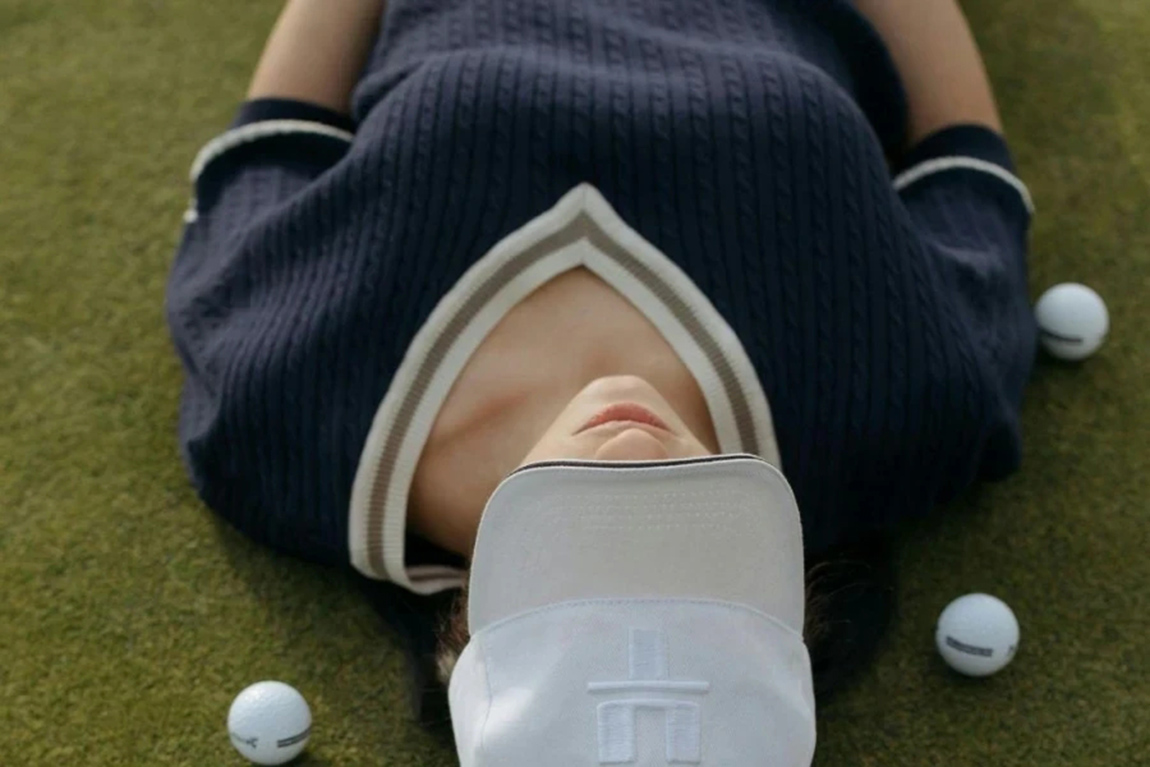 A-Woman-Golfer-Lying-on-Grass.webp.jpg