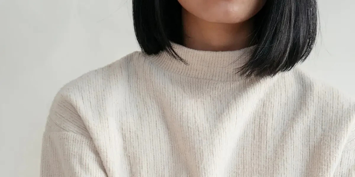 Close-Up-Showing-Detail-Of-Cream-Sweater.webp.jpg
