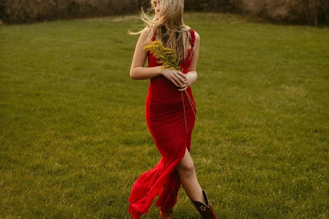 Blonde-Girl-in-Long-Red-Dress-in-Spring-Park-by-Megan-Ruth.webp.jpg
