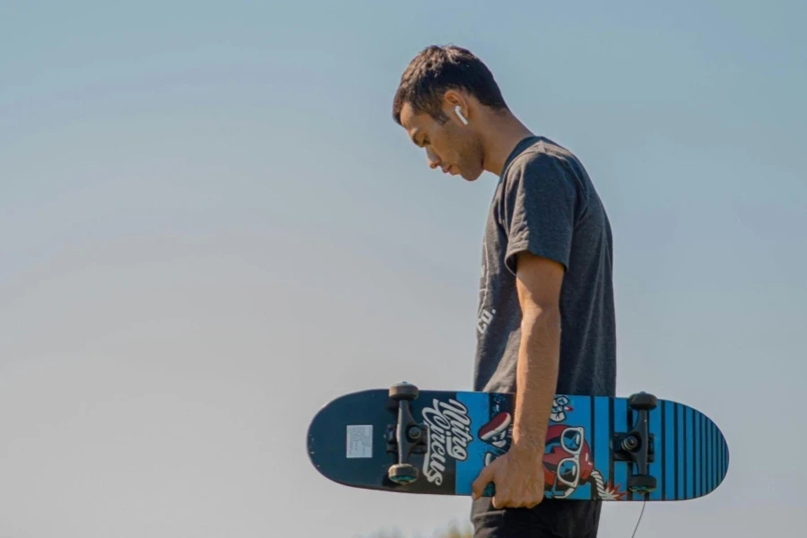 Man-Holding-A-Skateboard.webp.jpg