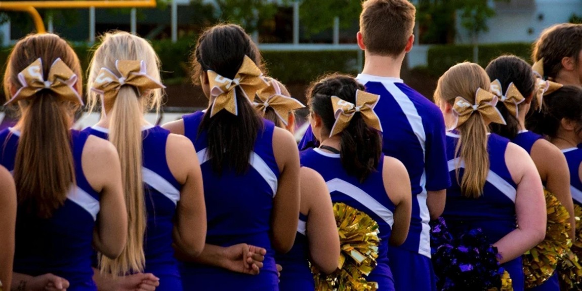 Photo-of-Cheerleaders-in-Blue-and-white-Uniform-by-Ashley-Williams.webp.jpg