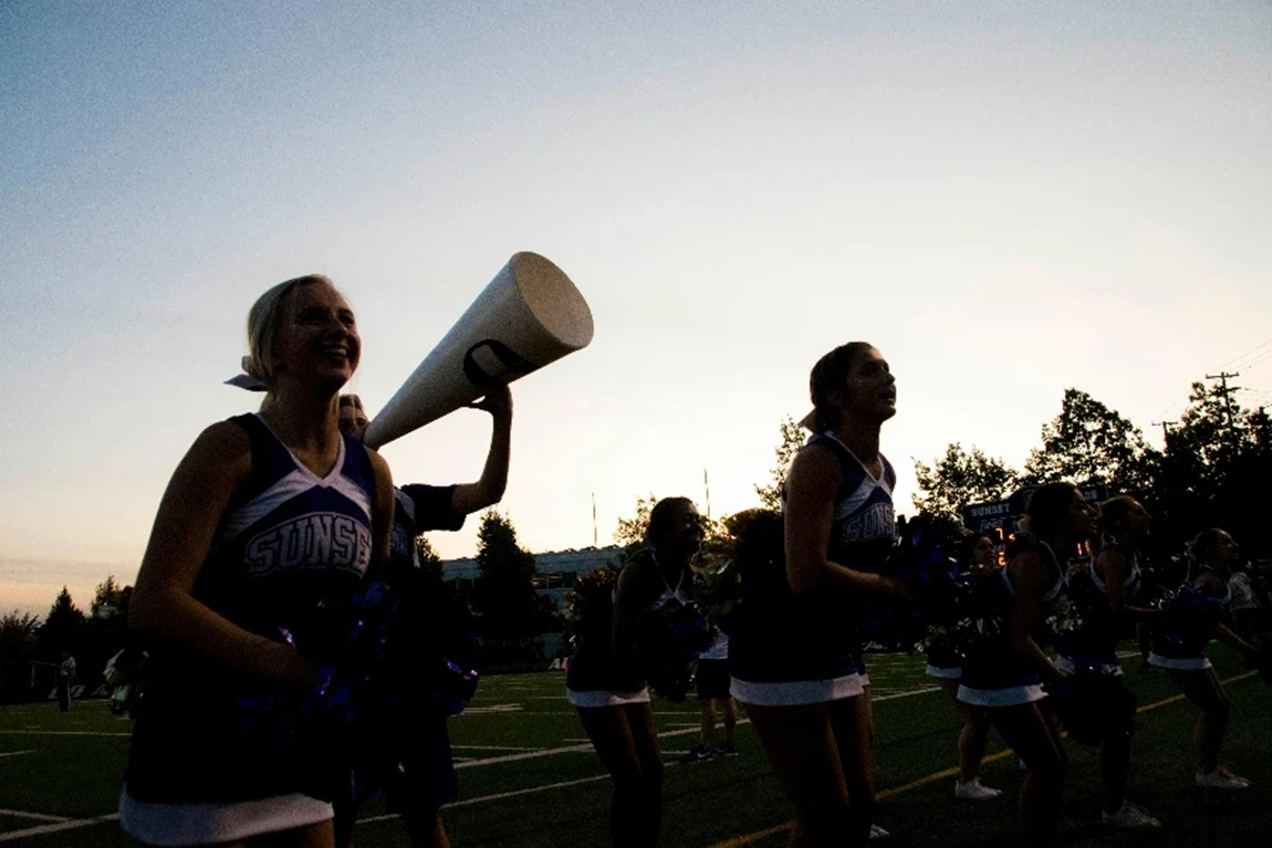 Cheering-Squad-on-Football-Field-by-Ashley-Williams.webp.jpg